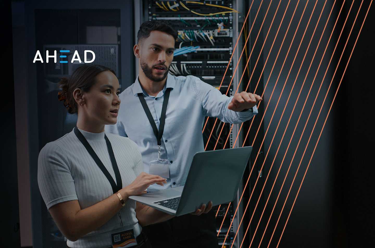 two people standing inside a data center