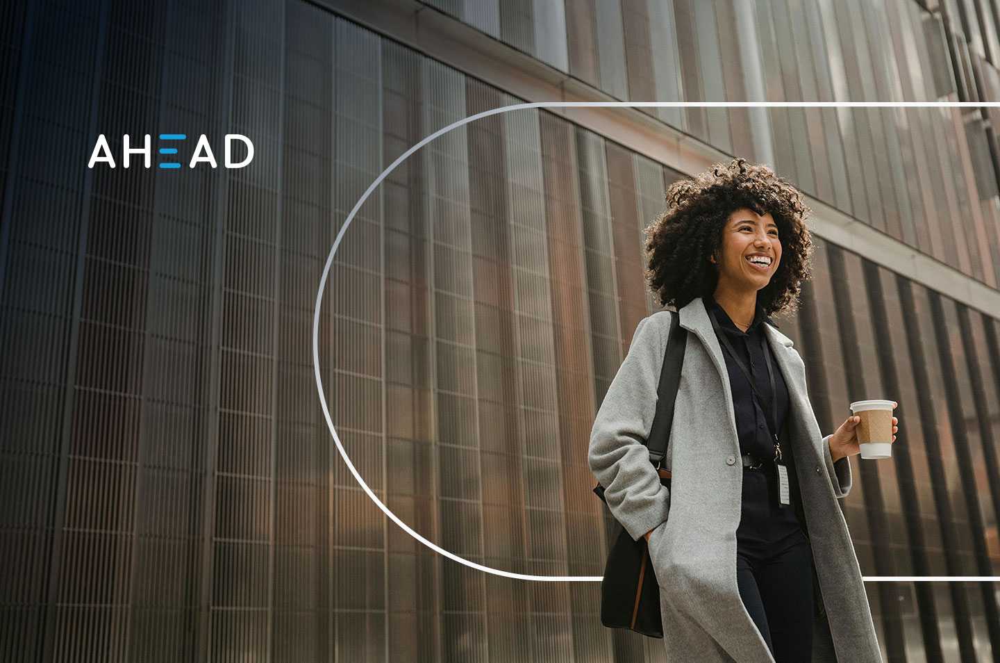 a woman holding a coffee cup and smiling